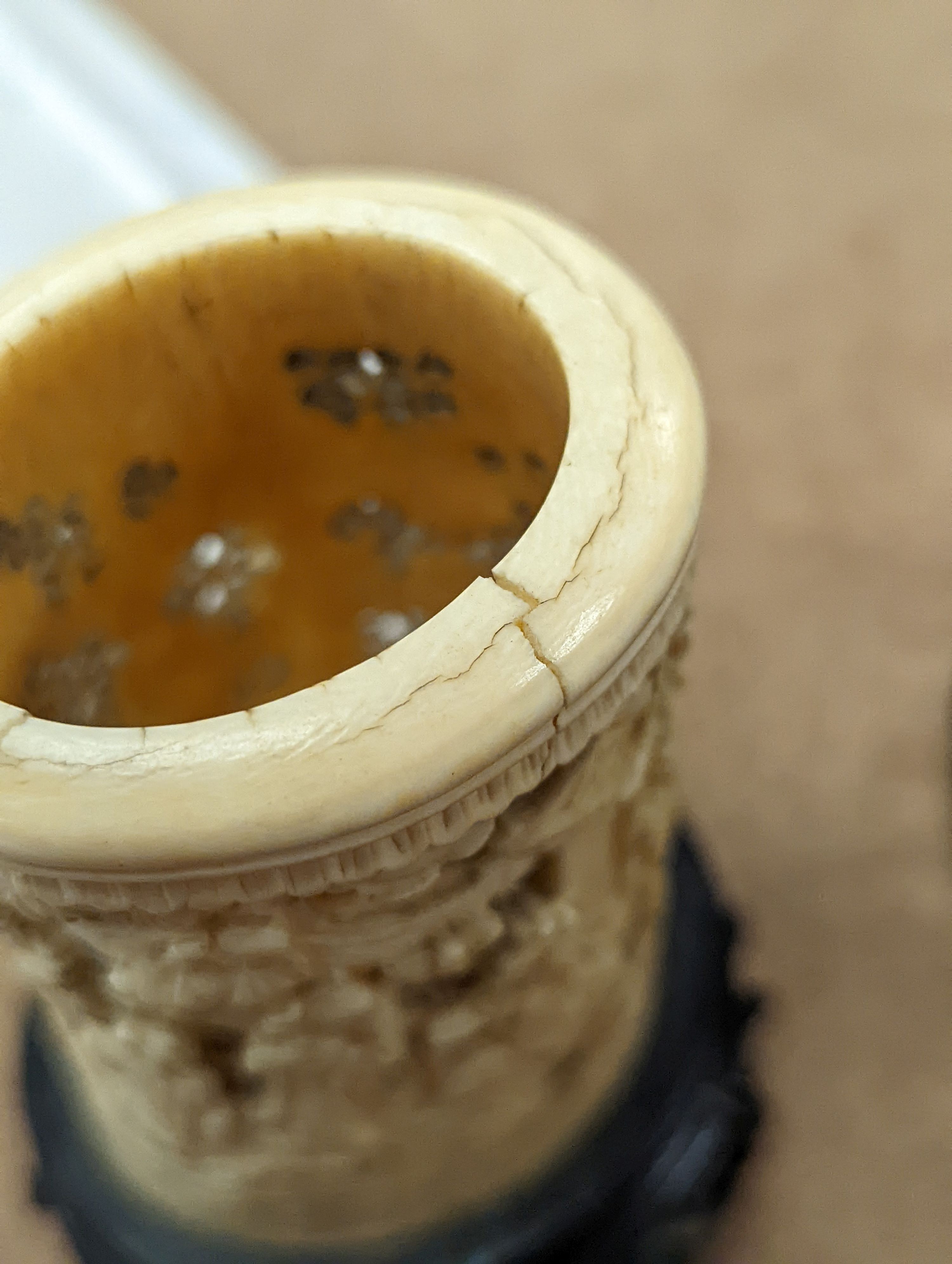 A pair of 19th century Chinese carved ivory brushpots on wooden stands - 12cm tall (including stands)